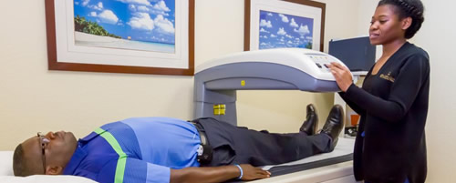 Nurse taking x-ray on patient